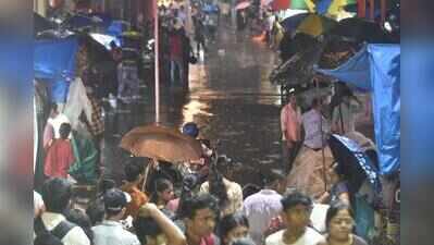 Evening rain sends shoppers scurrying for cover, leaves puja organisers worried