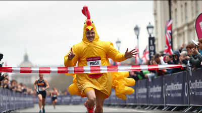 A man ran 26.2 miles in a giant inflatable chicken costume; he broke a Guinness World Record while raising more than £2,200 for vulnerable children