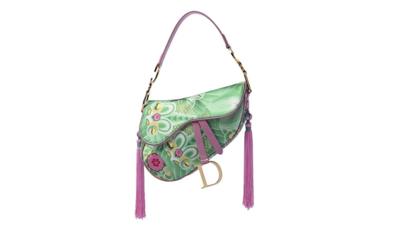 A woman paid about £80 for a Dior bag in a Cotswolds charity shop without knowing if it was genuine; experts identified it as a rare 2003 Koi Saddle Bag, and it later sold for £7,870