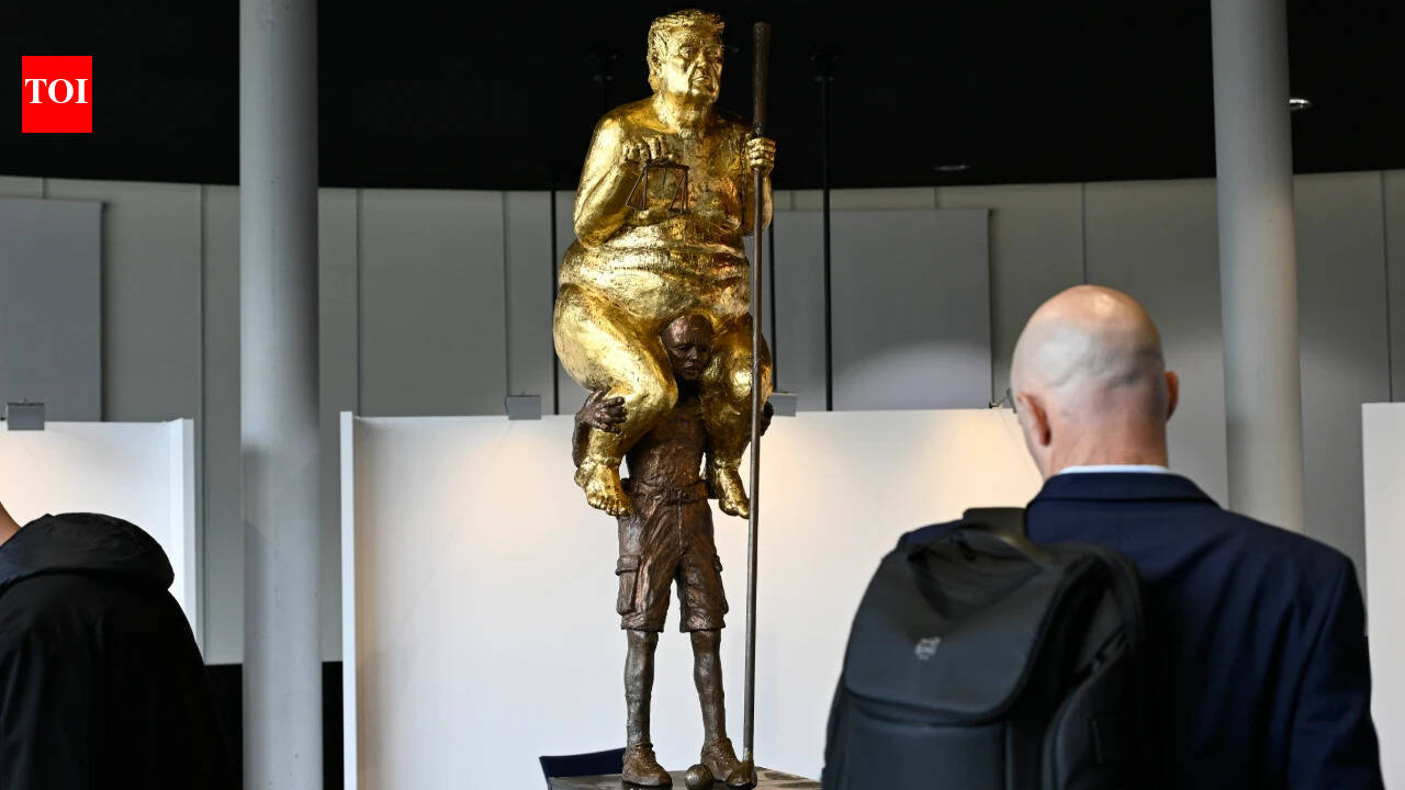 ‘The Orange Plague’: Why a golden, naked Trump is sitting on another man