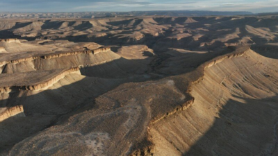 Utah approved blasting 100-foot canyon cliffs to widen a 5.3-mile road for oil trucks; after two earlier plans failed, a new federal lawsuit says 47 historic sites and 19th-century inscriptions are at risk