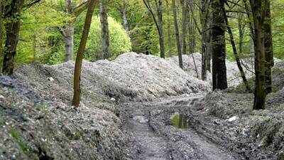 Nearly 39,500 tonnes of illegally dumped household and construction waste cleared from Hoad’s Wood, Kent; £15.5 million clean-up required 2,500 lorry-loads to remove rubbish piled up to 15 feet high