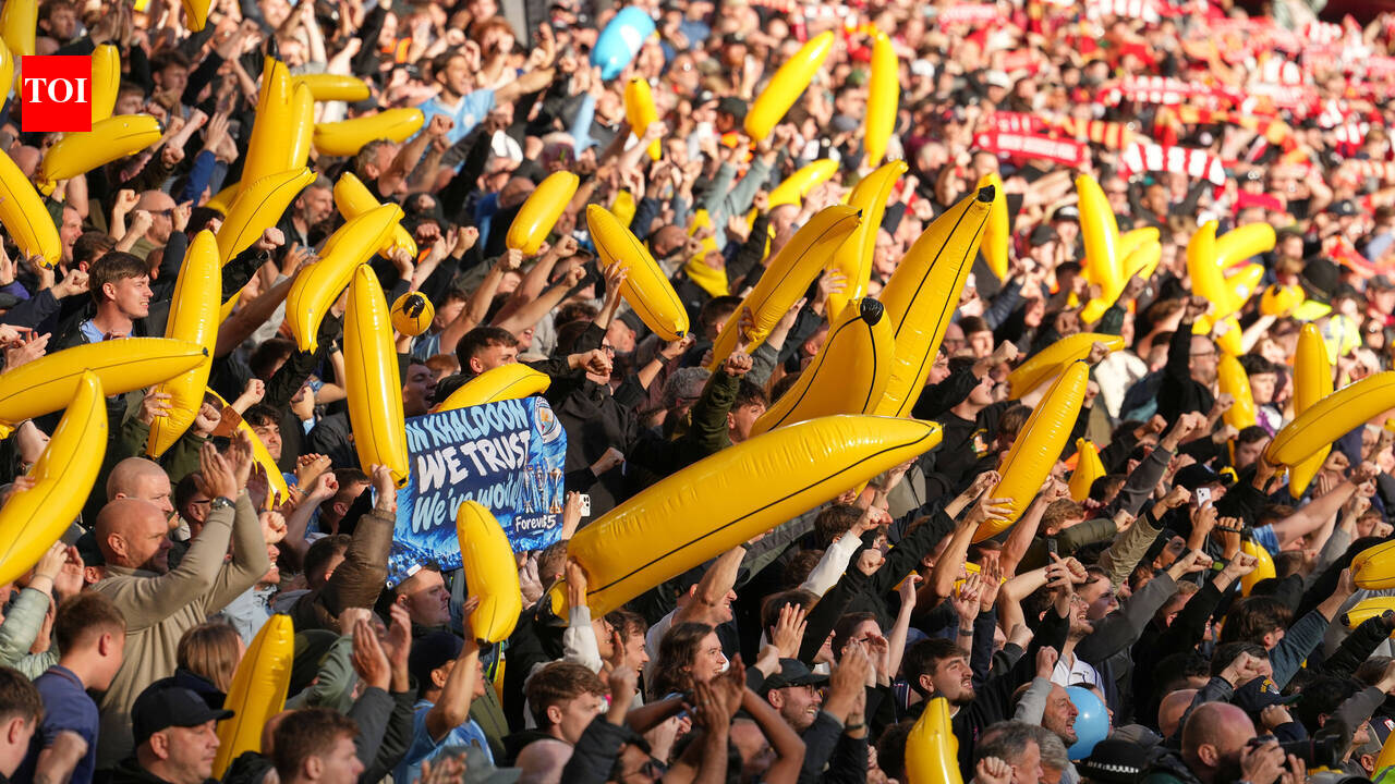 Manchester City fans with inflatable bananas at Anfield during the Premier League match against Liverpool
