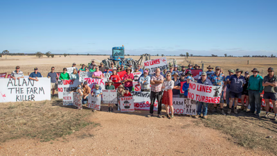 12 Australian farming families were fined $814 each for blocking surveyors; they say a proposed 480-kilometre power line threatens their land