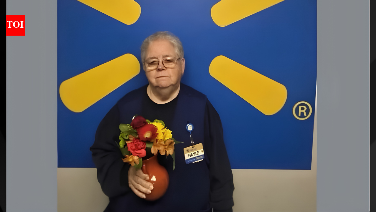 Walmart employee Gayle goes viral after a photo of her holding a bouquet has spa...