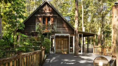 A couple bought a 3.04-hectare Australian estate for A$1.6 million and restored a derelict 1932 woodcutter’s cabin; the two-bedroom retreat now earns up to A$50,000 a year as a holiday rental