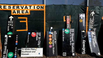 New Yorkers queued for hours to buy discarded subway hardware at an MTA sale where old signs cost $500 to over $1,000, orange seats sold for about $900 and Spike Lee picked up a Penn Station sign