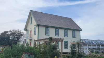 In 1901, Ocracoke opened a two-story island inn; after a $750,000 community purchase, hurricane delays and eight years of restoration, the raised building has passed final inspection as a public cultural center