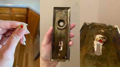 Hidden treasure behind 8 layers of paint: Couple restoring 1913 home finds a mystery ring glued inside a door plate