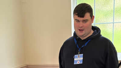 A blind UK man applied for more than 1,000 jobs without success and spent 16 months unemployed, then built an accessibility business; at 23, Brandon Hulcoop has won the King’s Trust Young Achiever award