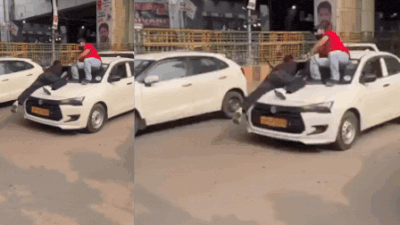 High drama caught on cam: Cab driver speeds away with 2 youths clinging to car bonnet in Noida