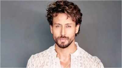 Tiger Shroff covers face, reaches home under police protection after Juhu firing; tape on hand draws attention
