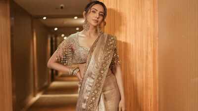 Rakul Preet Singh serves understated luxury in a Rs 2.75 lakh bronze gold tissue saree and embroidered zardozi blouse for ‘Ramayana: Rise of a Legend’ trailer launch - Exclusive