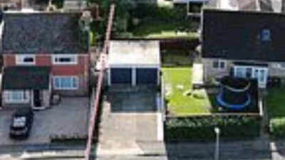 In 2022, a Russian Orthodox priest bought a £470,000 home beside a woman who paid £260,000 for hers; their fight over a one-metre strip of land has led to CCTV, criminal charges and a holy-water blessing at the fence