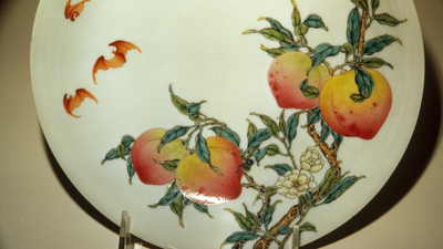 Between 1723 and 1735, Qing artisans made a porcelain bowl painted with bats and peaches; after passing through a Paris dealer and spending 87 years at a Chicago museum, it sold for $2.048 million in New York