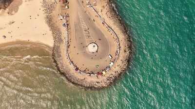 A cyclone wiped out Dhanushkodi in 1964 destroying its railway line and homes; six decades later, visitors travel to the ghost town to see abandoned ruins where the Bay of Bengal meets the Indian Ocean