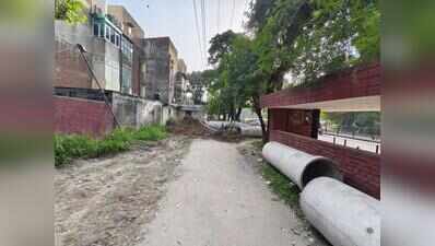 Parked cars barriers, leaning poles sentries on Chandigarh’s bicycle tracks.