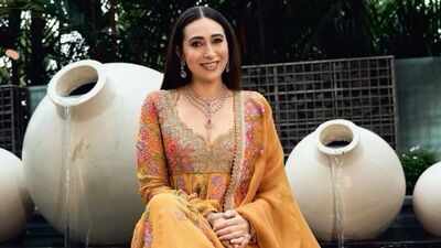 Karisma Kapoor showcases timeless ethnic elegance in a yellow Anarkali set worth Rs 2.95 lakh with intricate zardozi embroidery