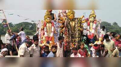 Devotees hold Durga idol immersion boat procession in Rajnagar