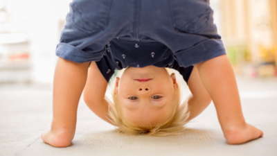 Psychology says your child bending down to see the world between their legs isn't as random as it looks; here's what it could mean