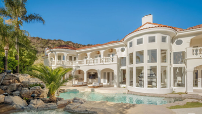 In 1991, John Stamos bought six acres in California for $430,000 and built a mansion; after later owners spent over $3 million renovating it, its asking price fell from $13 million to $6.4 million by 2026