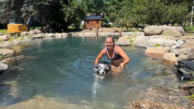 On their 65-acre Canadian property, Crystal Drinkwalter and Jazmyn Canning built a natural swimming pond for $52,000 after estimating professional construction could cost up to $200,000, moving 100,000 pounds of rock