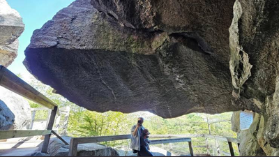 An 80-ton boulder that had hung above visitors at New Hampshire's Polar Caves since the park opened in 1922 collapsed on the final day of the 2026 season, smashing a walkway but injuring no one