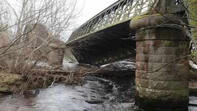 Two spans of a 140-year-old Scottish railway bridge fell into the River Spey; engineers are investigating the collapse as restoration options could cost more than £1 million