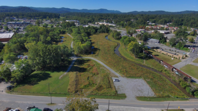 In 2002, a North Carolina city acquired flood-prone land; 24 years later, it has restored 27 acres of wetlands and streams, adding flood storage intended to protect up to 93 properties valued at about $60 million