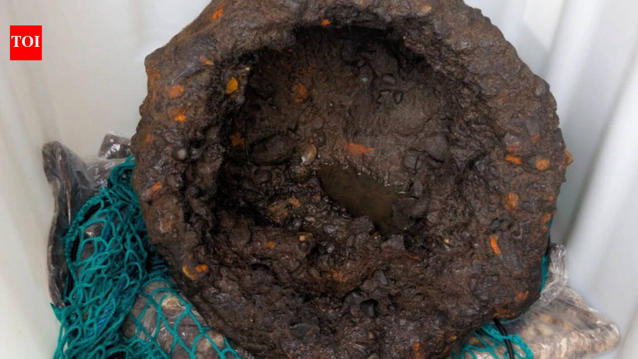 Diver finds centuries-old three-legged iron cauldron in England's River Wear