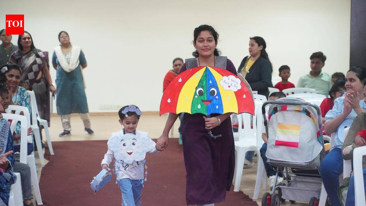 Kindergarten children and parents walk the ramp in Kolkata