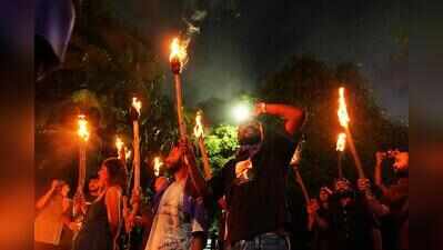 Cops enter SRFTI campus at night after torchlight march