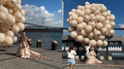 Bride nearly flies away with giant balloons during Istanbul photoshoot; photographer rushes to save her