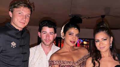 Priyanka Chopra wears embroidered Indian outfit with floral gajra as Nick Jonas matches in cream and white at star-studded Diwali gathering in LA
