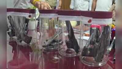 Two men held with five illegal pistols; one accused wanted in 8 criminal cases