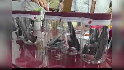 Two men held with five illegal pistols; one accused wanted in 8 criminal cases