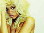 Rihanna strips for 'Nude' fragrance!