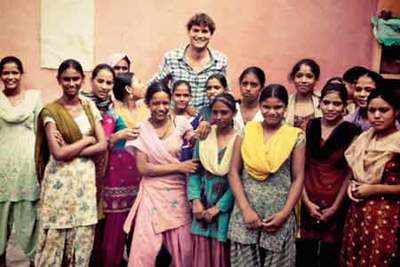 Ashton Kutcher spends time with NGO's girls