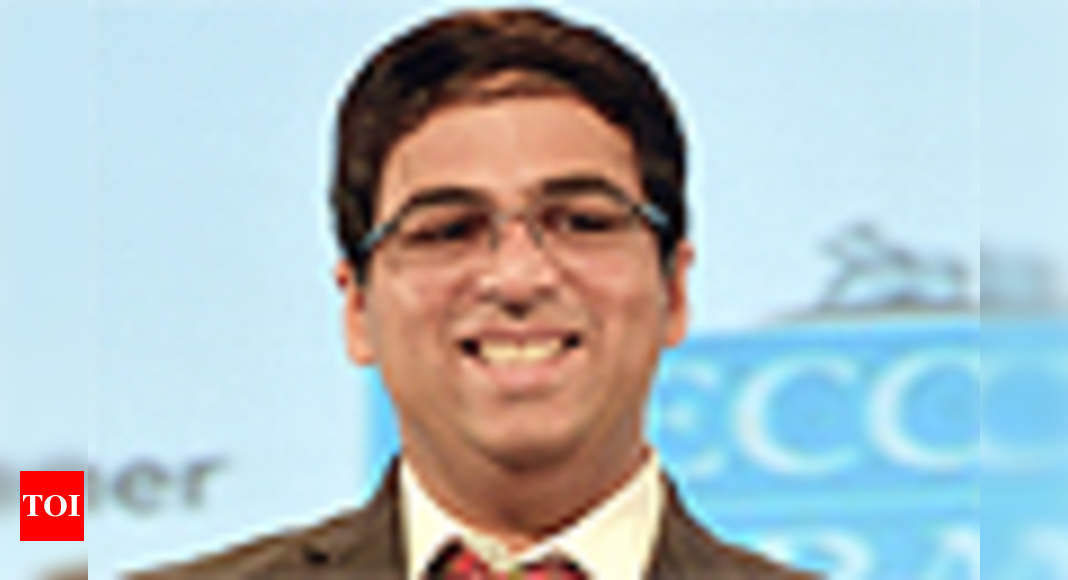 World chess champion Viswanathan Anand of India holds a trophy at an award  presentation ceremony of the FIDE World Chess Championship in Moscow,  Russia, Thursday, May 31, 2012. Anand oretained his title