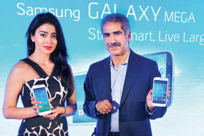 Shriya Saran launches two models Samsung GALAXY Mega with Vineet Taneja in Delhi