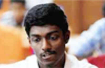 Adhiban advances to third round of World chess cup - Rediff.com