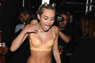 Miley Cyrus goes topless for Bangerz's alternative cover art