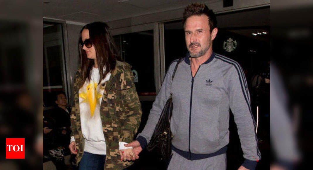 David Arquette carries his son Charlie, 14 months, with wife Christina  McLarty