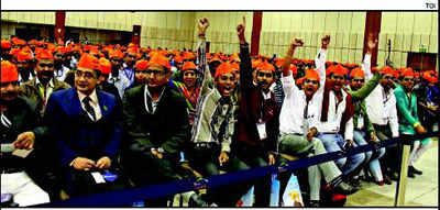 Saffron Gandhi caps surface at Modi's function