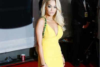 Rita Ora makes heads turn in a yellow dress