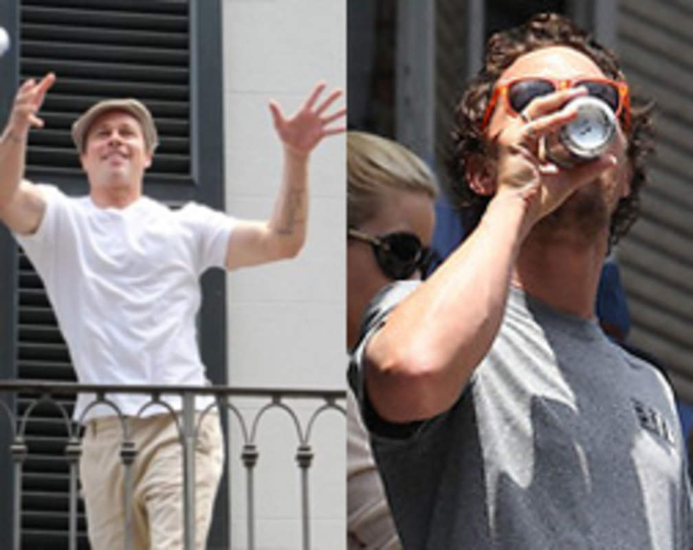 
Brad Pitt throws Matthew McConaughey a beer from his balcony
