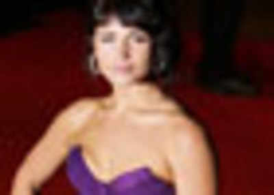 Bond girl Gemma flaunts her curves