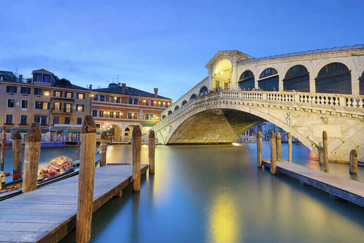 Stroll across the Rialto Bridge