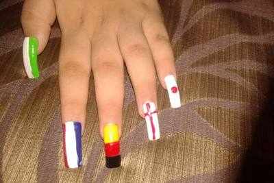 Cheer on with football manicures