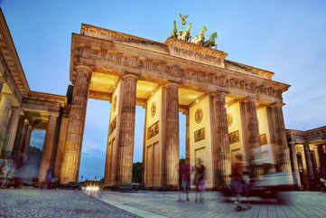 Pose for pictures at the Brandenburg Gate